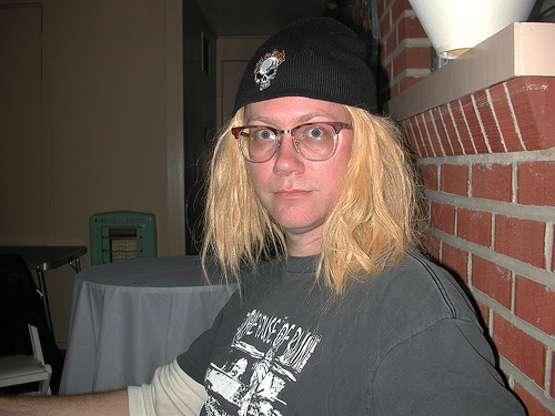 A man wearing a blond wig